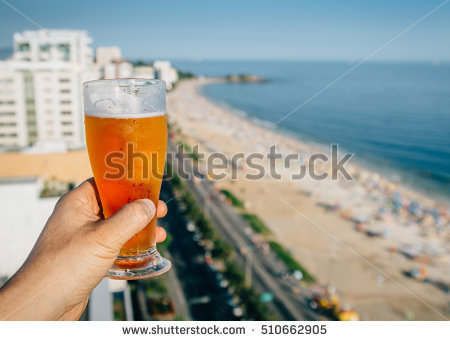 stock-photo-beer-and-rio-de-janeiro-brazil-beach-background-510662905
