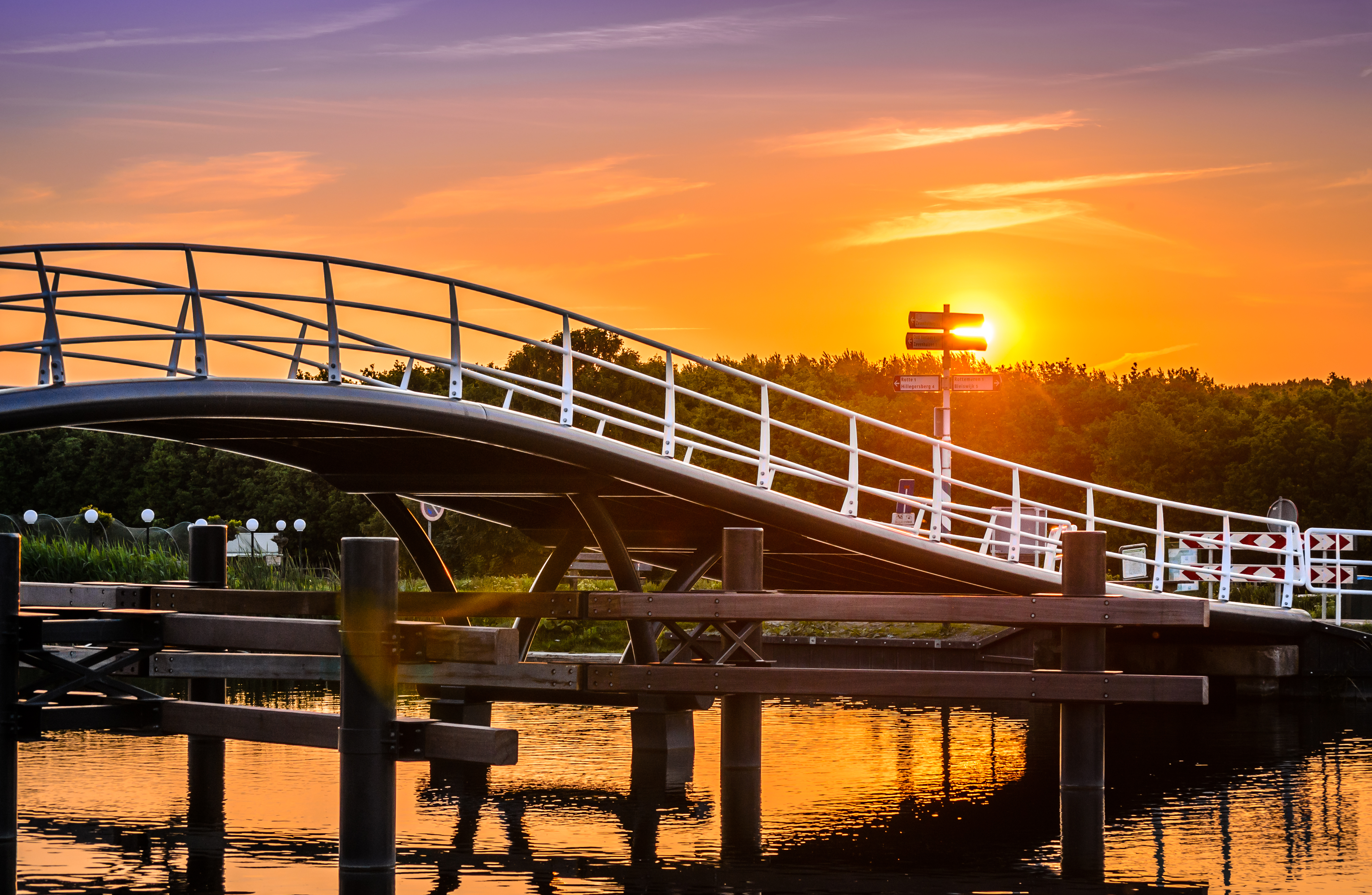 Cycling bridge with sunset