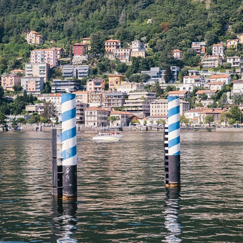 Frame of boat on pier posts at Como in Lake Como, Italy