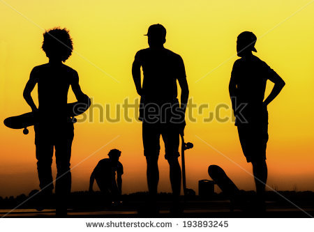 stock-photo-silhouette-of-generation-x-skaters-at-sunset-193893245