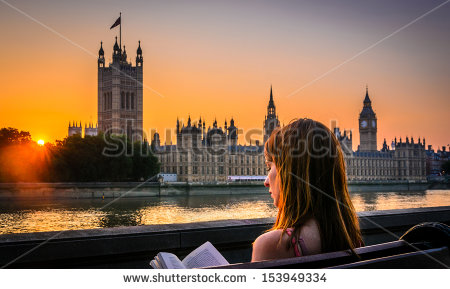 stock-photo-woman-reading-a-book-next-to-houses-of-parliament-london-153949334