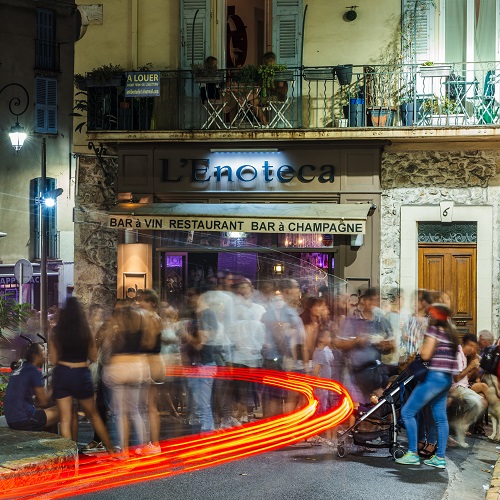 Long exposure of young people drinking in Antibes, Cote d'Azur, France