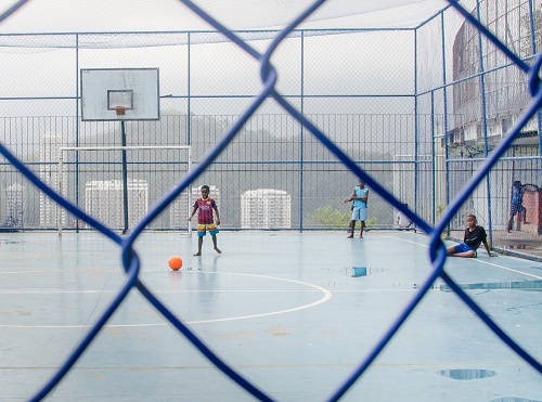 Kids playing football in favela