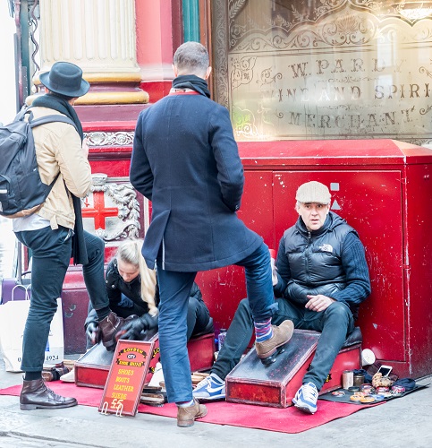 Shoe shiner in London's Leadenhall Market