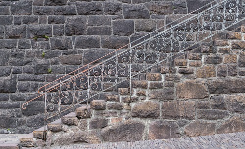 Old stairs against a rock facade