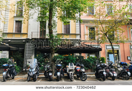 stock-photo-a-street-in-milan-lombardy-italy-against-a-colourful-facade-723040462