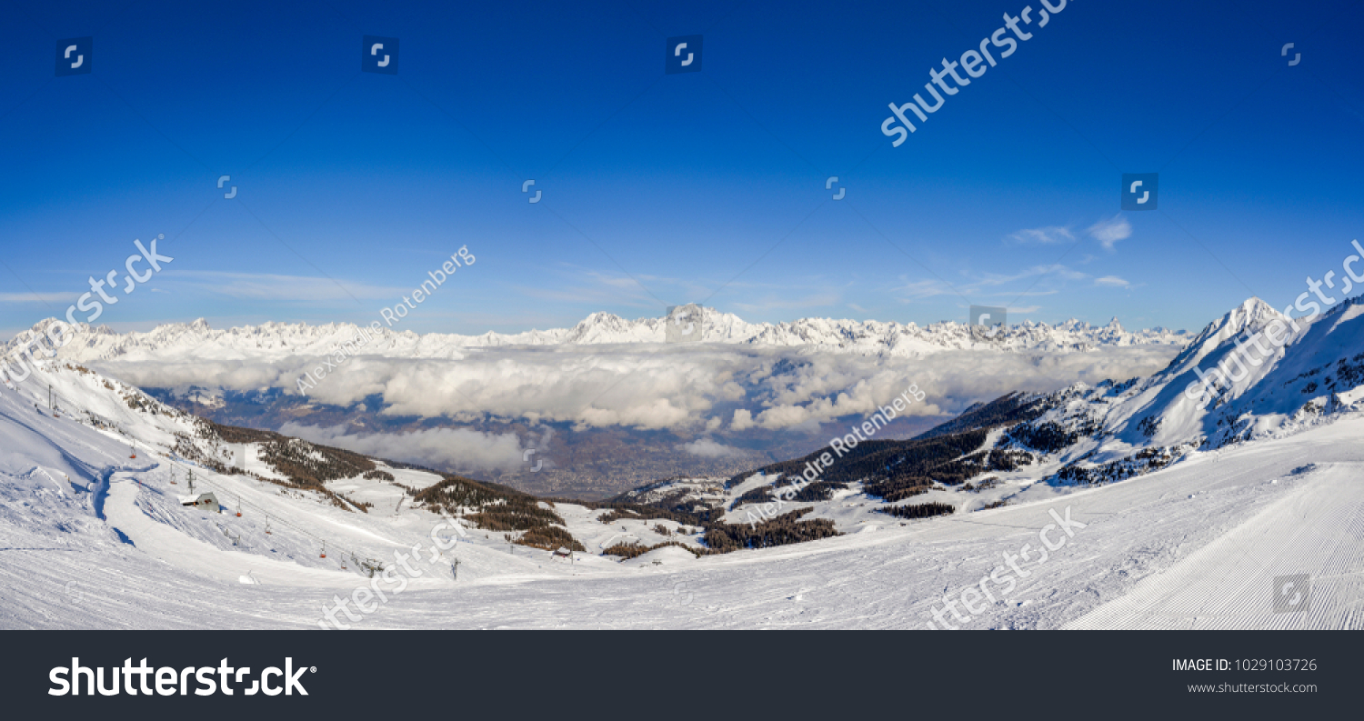 stock-photo-panoramic-view-of-european-alps-during-winter-captured-at-aosta-in-italy-facing-north-towards-1029103726