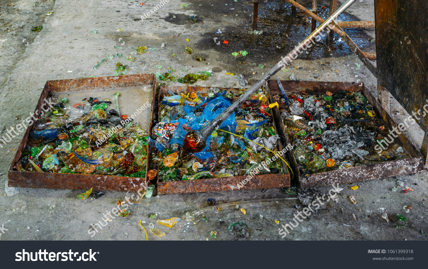 stock-photo-glass-blower-instruments-and-crushed-glass-of-different-colours-in-a-workshop-1061399318
