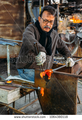 stock-photo-murano-italy-march-th-a-man-works-on-a-glass-piece-using-a-hot-furnace-in-a-workshop-1064380118
