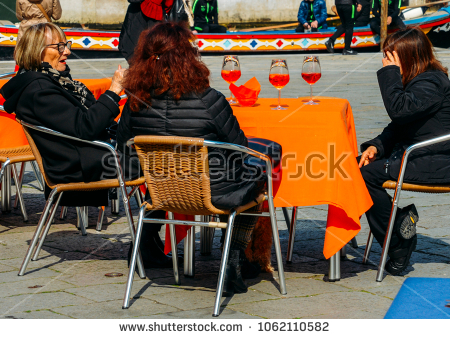 stock-photo-venice-italy-march-older-women-enjoying-a-cocktail-drink-on-a-terrace-1062110582