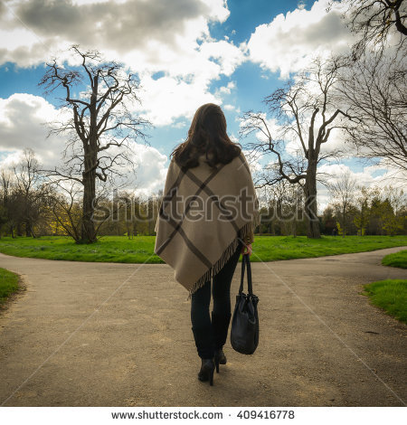 stock-photo-woman-making-tough-life-decisions-on-fork-in-road-409416778