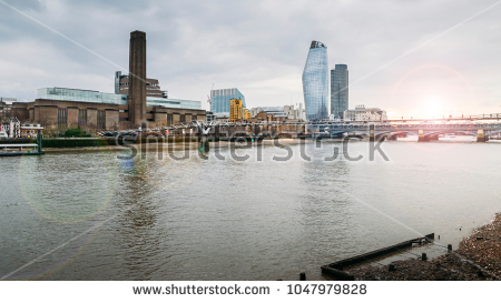 stock-photo-view-from-the-northern-side-of-the-thames-towards-unidentifiable-pedestrians-crossing-the-1047979828