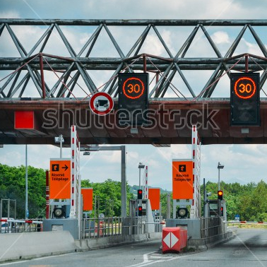 stock-photo-southwest-france-june-cars-passing-through-the-point-of-toll-highway-toll-station-in-1125049763