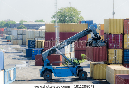 stock-photo-a-truck-picks-up-a-container-for-import-export-business-1011285073