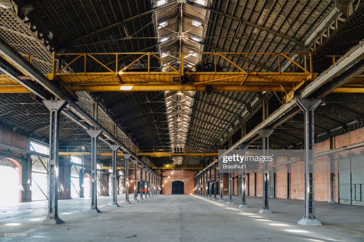 Old and dusty warehouse with light coming through openings