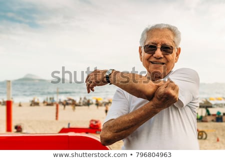 older-man-8085-stretching-his-450w-796804963