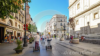 seville-spain-july-th-tourists-segways-av-de-la-constitucion-historic-centre-andalusia-123902970