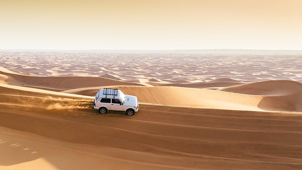 Offroad vehicle on sand dunes near Dubai in the United Arab Emirates