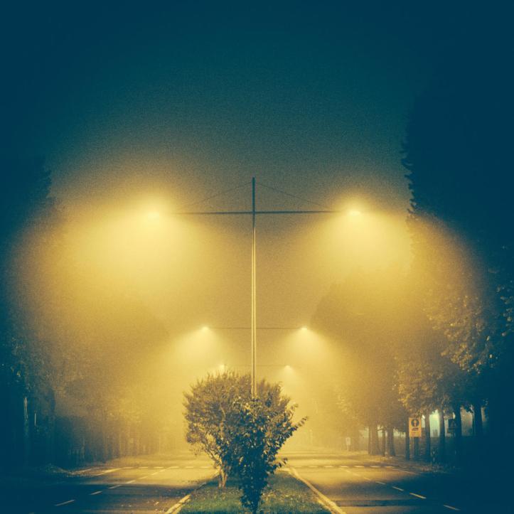 Dramatic street lights with lamp posts - symmetry and heavy filter