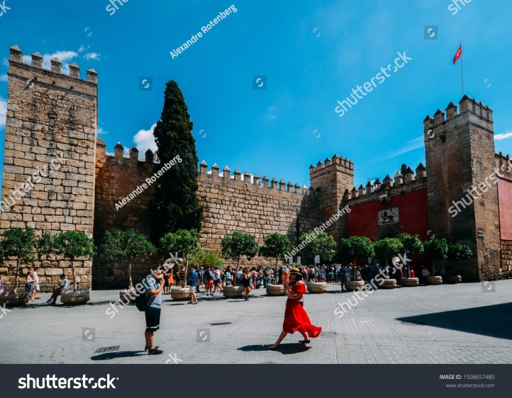 stock-photo-seville-spain-sept-tourists-take-pictures-and-others-queue-to-enter-the-landmark-1508657480