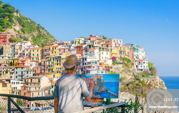 A painter at Manarola, Cinque Terre, Italy