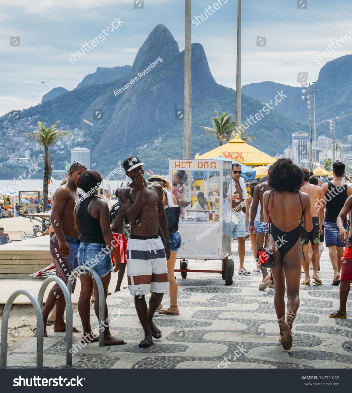stock-photo-rio-de-janeiro-brazil-jan-man-checks-out-beautiful-afro-brazilian-woman-walking-down-787929463