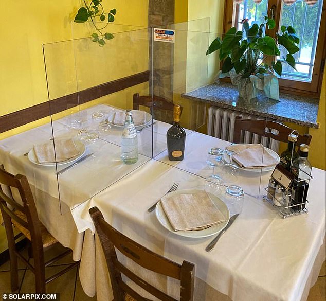27236198-8221339-Plexiglass_pictured_in_restaurant_is_hoped_to_be_a_possible_solu-a-6_1586976398401